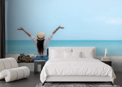 Lifestyle freelance woman using laptop working and relax on the beach.  Asian people success and together your work pastime and meeting conference on internet in holiday. Business and Summer Concept Wall mural